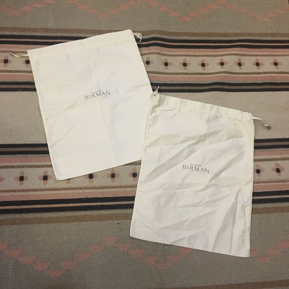Two (2) Alexandre Birman soft white drawstring Dustbag 16” x 8”
Garment